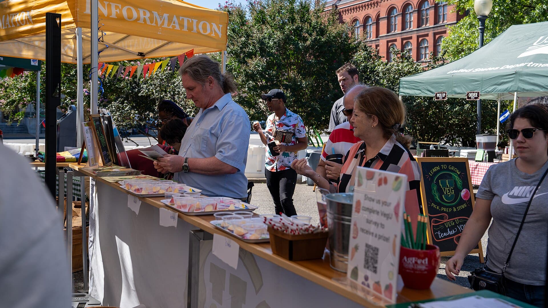 Vendors and visitors at the USDA Farmers Market on the National Mall