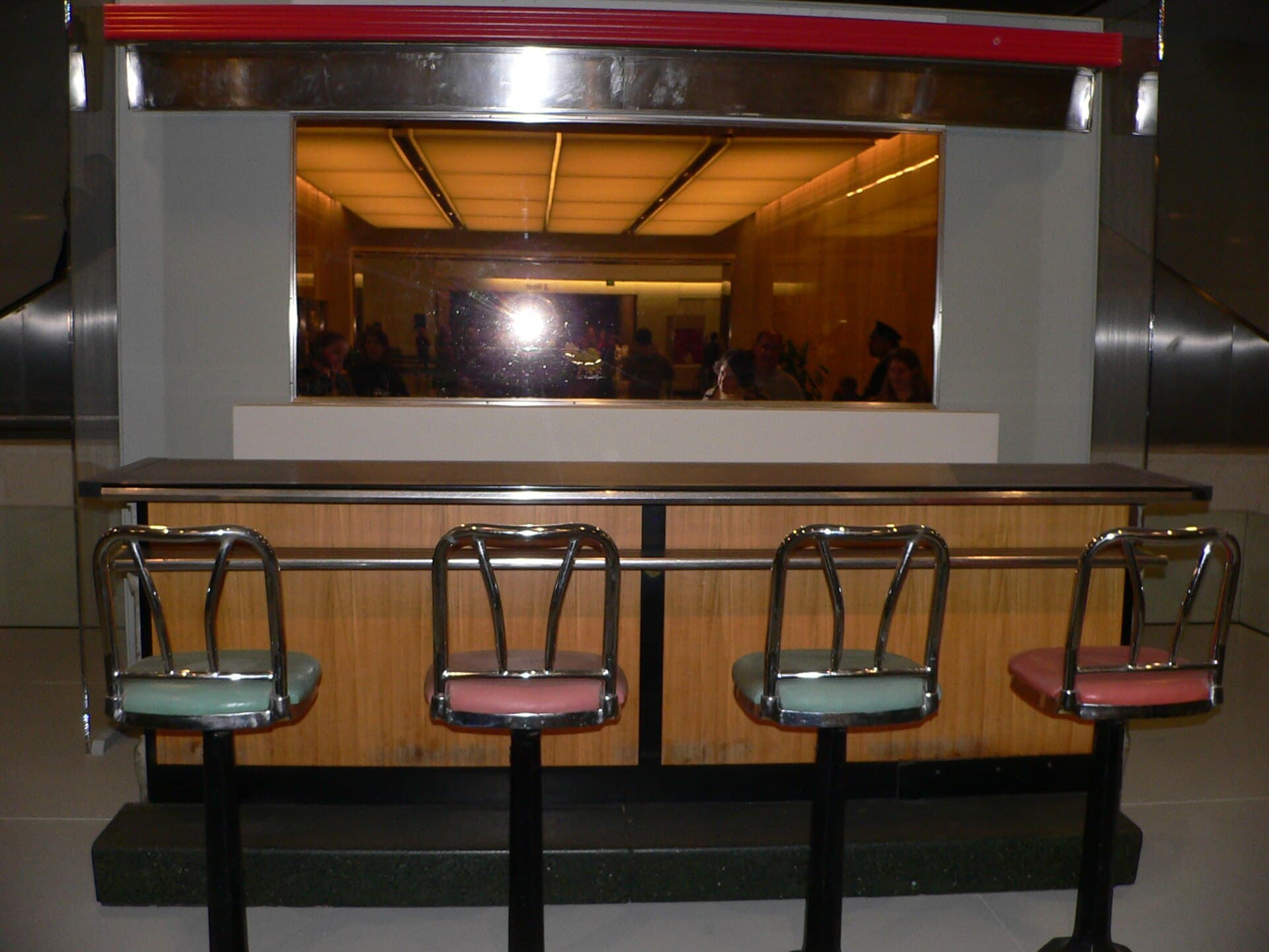 Preserved Greensboro lunch counter and stools on display at the Smithsonian