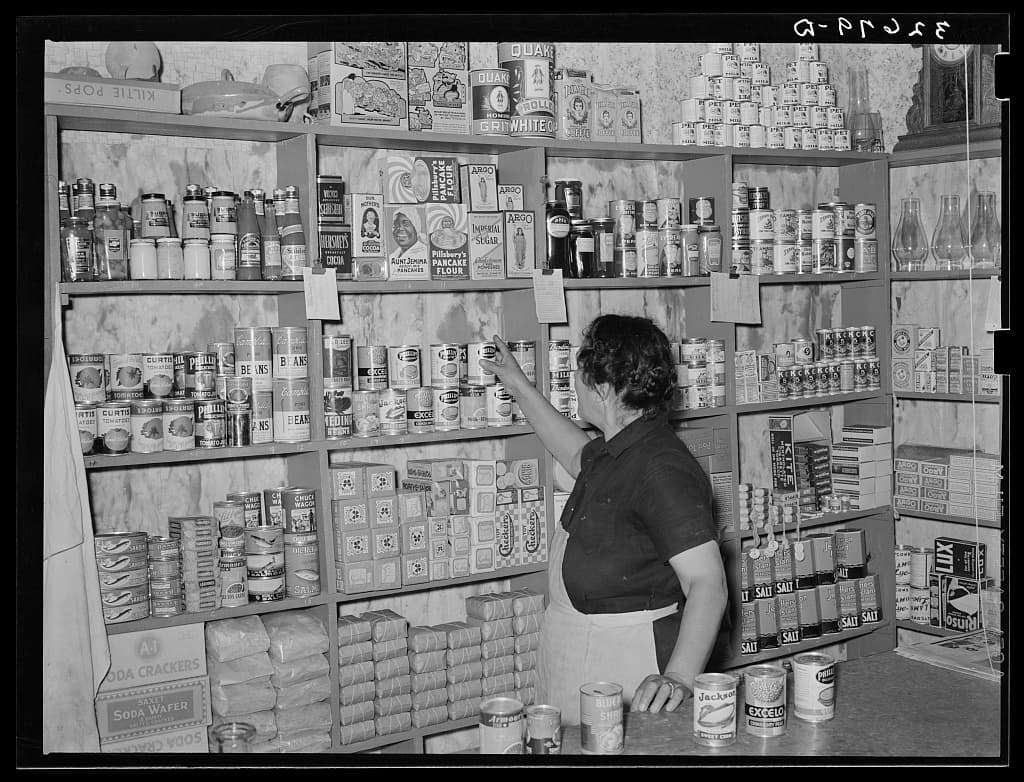 Shelves of canned goods inside a small Mexican grocery store in San Antonio in 1939