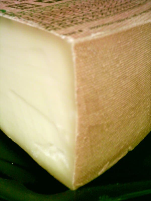 Alpine-style cheese wedge