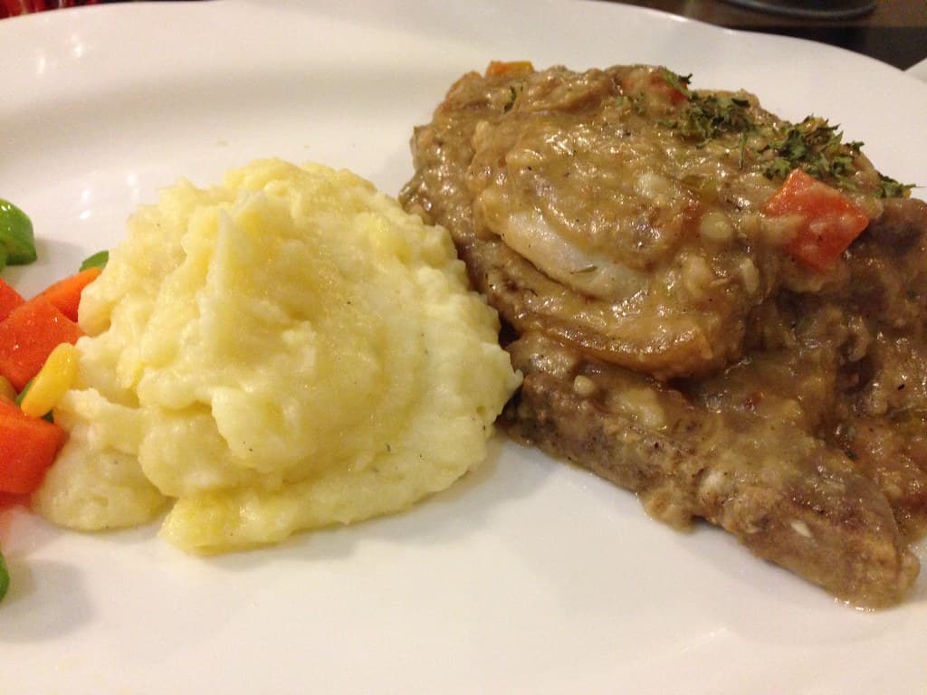 Smothered Pork Chops prepared as a finished dish
